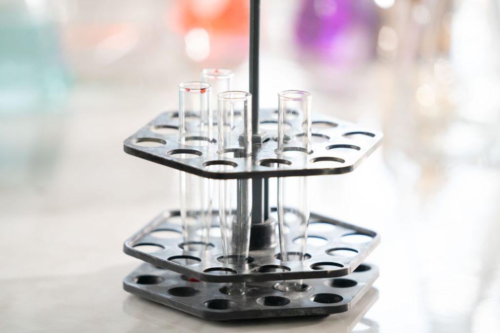 Test tubes arranged in a rack, showcasing laboratory equipment for analysis.