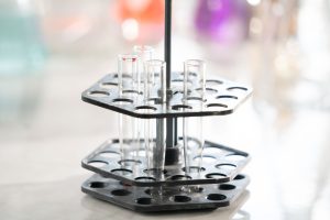 Test tubes arranged in a rack, showcasing laboratory equipment for analysis.